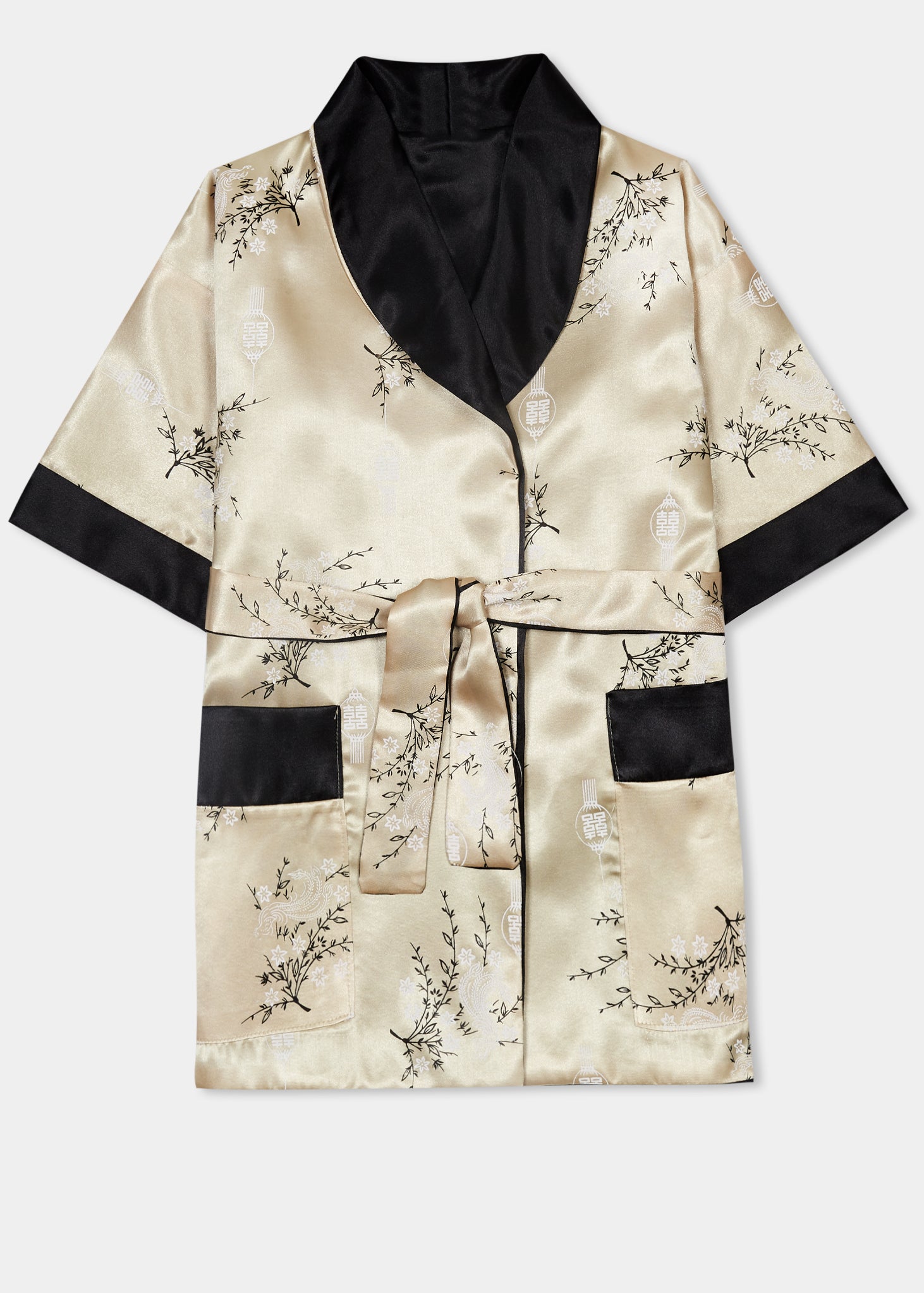 Traditionally styled fully reversible kimono with shawl collar, patch pockets and tie belt. Manufactured in a classic gold silky rayon/polyester with a bird of paradise and Chinese lantern print - a symbol of joy and good fortune to one side. Solid black with large dragon embroidery to reverse side.
