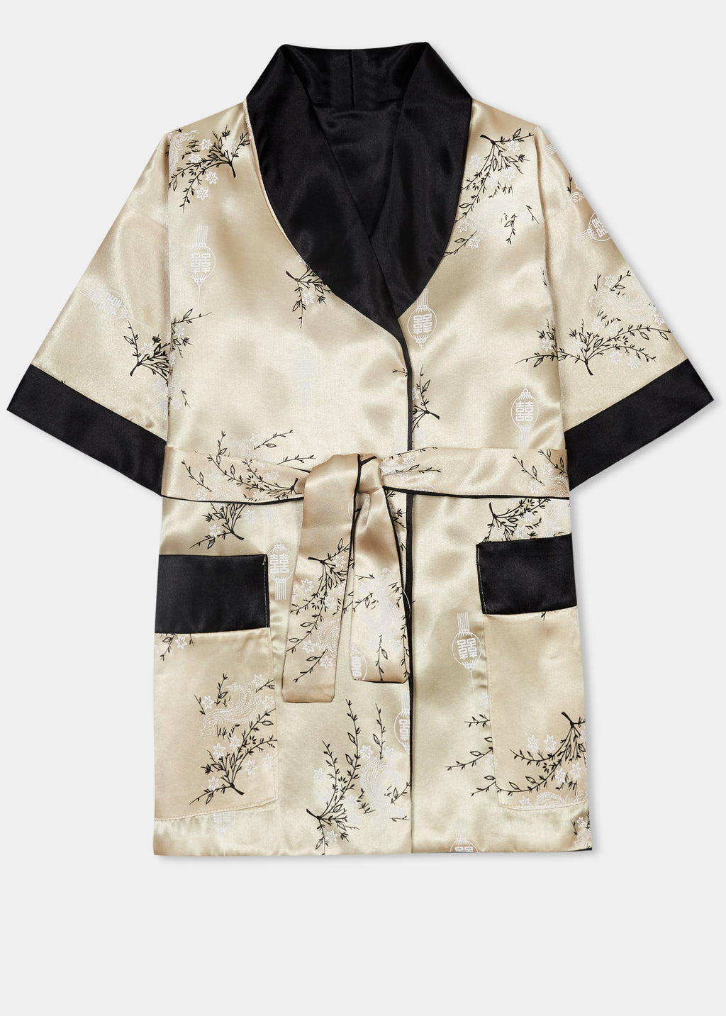 Traditionally styled fully reversible kimono with shawl collar, patch pockets and tie belt. Manufactured in a classic gold silky rayon/polyester with a bird of paradise and Chinese lantern print - a symbol of joy and good fortune to one side. Solid black with large dragon embroidery to reverse side.