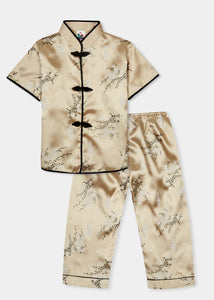 Traditionally styled pyjamas with Chinese features of mandarin collar and flower and knot frog fastenings. Manufactured in a classic gold silky rayon/polyester with a bird of paradise and Chinese lantern print - a symbol of joy and good fortune. Pyjama top has short sleeves, contrast bound mandarin collar and centre front opening which closes with flower and knot frog fastenings. Elasticated waist pyjama bottoms with contrast piped hem cuffs