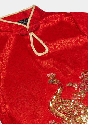 Cap sleeves, discreet side zip, mandarin collar with gold bound keyhole opening and flower and knot frog fastening. Side splits with gold binding. Large peacock applique embroidery with gold thread and sequins