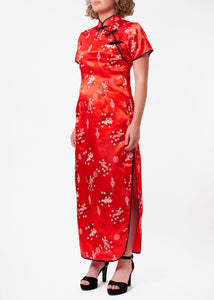 The Cheongsam or Qipao, is a feminine body-hugging dress with distinctive Chinese features of mandarin collar, side splits and flower and knot frog fastenings. Manufactured in stunning red silky polyester with a bird of paradise and Chinese lantern print - a symbol of joy and good fortune