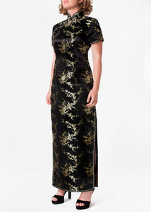The Cheongsam or Qipao, is a feminine body hugging dress with distinctive Chinese features of mandarin collar, side splits and flower frog fastenings. Manufactured in high quality silk/rayon brocade fabric which has a beautiful lustre. In black with a gold cherry blossom design - a symbol of female beauty and love.
