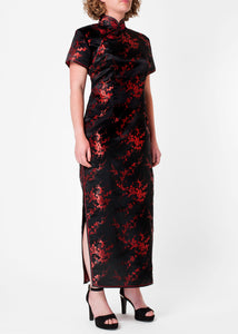 The Cheongsam or Qipao, is a feminine body-hugging dress with distinctive Chinese features of mandarin collar, side splits and flower frog fastenings. Manufactured in high quality silk/rayon brocade fabric which has a beautiful lustre. In black with a red cherry blossom design - a symbol of female beauty and love.