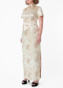 The Cheongsam or Qipao, is a feminine body-hugging dress with distinctive Chinese features of mandarin collar, side splits and hand stitched flower frog fastenings. Manufactured in high quality silk/rayon brocade fabric in a classic gold cherry blossom design - a symbol of female beauty and love.