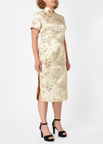 The Cheongsam or Qipao, is a feminine body-hugging dress with distinctive Chinese features of mandarin collar, side splits and hand stitched flower and knot frog fastenings. Manufactured in authentic high quality silk/rayon brocade in a classic gold cherry blossom design - a symbol of female beauty and love.