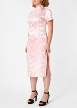 The Cheongsam or Qipao, is a feminine body-hugging dress with distinctive Chinese features of mandarin collar, side splits and hand stitched flower and knot frog fastenings. Manufactured in authentic high quality silk/rayon brocade in a beautiful subtle pink cherry blossom design - a symbol of female beauty and love.
