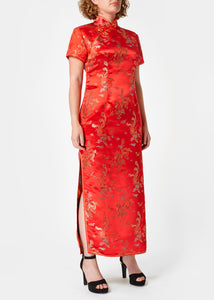 The Cheongsam or Qipao, is a feminine body-hugging dress with distinctive Chinese features of mandarin collar, side splits and hand stitched flower and knot frog fastenings. Manufactured in authentic high quality silk/rayon brocade in a stunning red dragon and phoenix design - a symbol success and prosperity